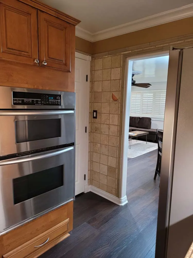Marine Avenue condo kitchen and transition space after remodel